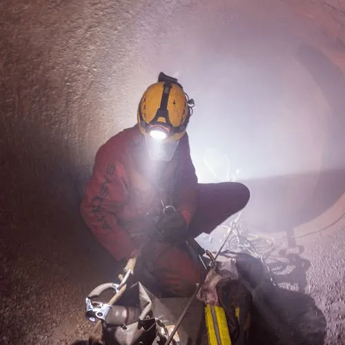 OSHA Confined Space Awareness Training man in PPE in a confined space